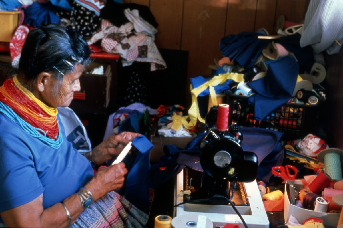 Lottie Shore using a sewing machine- Ochopee, Florida.
