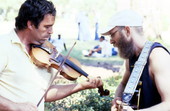 Tom Van Treese playing fiddle and Bill Webb playing guitar during a fiddling contest - White Springs, Florida