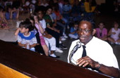 Alex McBride playing blues piano at Pine Estates Elementary School - Jacksonville, Florida.