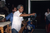 Furniture store personnel spotting bidders during auction - Jacksonville, Florida.