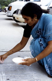 Prema Kuman making Kolam art - Jacksonville, Florida.