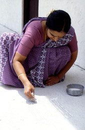 Menea Venkateswaran making Kolam art - Jacksonville, Florida.