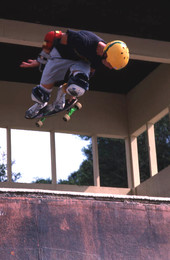 Skateboarder on a half pipe performing aerial moves - Jacksonville, Florida.