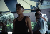 Boy modeling his hair at the 1991 Florida Folk Festival - White Springs, Florida