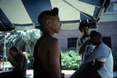 Boy modeling his hair at the 1991 Florida Folk Festival - White Springs, Florida