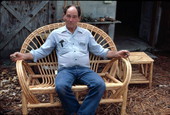Robert Rudd sitting in a cypress chair he made - Lake Worth, Florida.