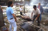 Removing the lechon from the barbecue pit - Jacksonville, Florida