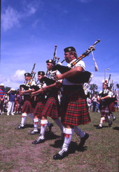 View showing a Scottish pipe band performing at the Highland Games in Dunedin, Florida.