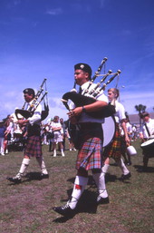 Close-up view showing members of a Scottish pipe band during their performance at the Highland Games in Dunedin, Florida.
