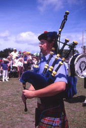 Close-up view showing a member of a Scottish pipe band performing at the Highland Games in Dunedin, Florida.