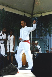 Man dancing with Cuban dance and music ensemble Ife-Ile during a performance at the Historical Museum of Southern Florida's Harvest Festival in Miami, Florida.