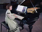Suzette Cason sitting at a janko piano- White Springs, Florida.