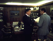 Governor Claude Kirk, right, talking with an unidentified man at a horse farm