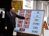Governor Claude Kirk with a display board of license plates