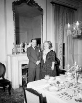 Thomas and Margaret Hood next to dining room table with tableware and silverware sets on display at Goodwood