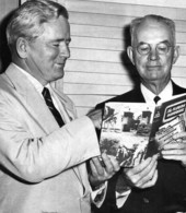 Governor Warren and ex-governor Carlton viewing the Florida Handbook