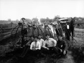 Eight young men with Penny-Farthing bicycles.
