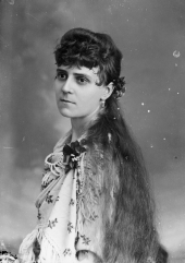 Mrs. Ed Lewis? draped in a printed and tassled shawl.
