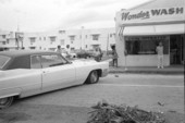 View of car blocking street with tires flattened by anti-war protesters during a rally in Miami Beach, Florida.