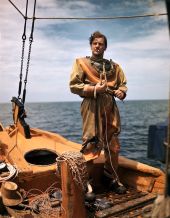 Sponge diver John M. Gonatos putting on his diving suit in Tarpon Springs, Florida.