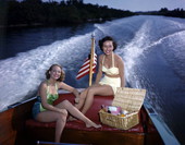 Photographer's daughter Lois Duncan Steinmetz, left, and friend Polly Gaines in a motorboat.