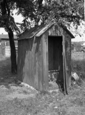 View showing the girls side of a dual outhouse.