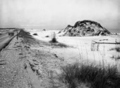View showing sand dunes on the beach.