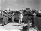 Sarasota photographer Joe Steinmetz taking a group portrait of George Town's entire police force (5 men) in the Cayman Islands.