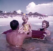 Nelson family in the Gulf with a raft near Sarasota, Florida.