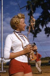 Sarasota High School student and Sailor Circus acrobatic performer Judy Laurent with a camera.