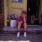Unidentified girl with flowers.