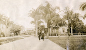 Koreshans walking on a sidewalk in Everglades City, Florida.