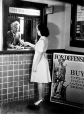 Eunice Priest Clark buying savings bond from Lem Crandall at post office - Madison, Florida