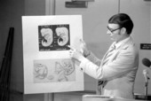 Unidentified man shows his drawings at a lecture - Tallahassee, Florida