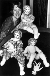Jan Alovus poses with a display of her birthing dolls - Tallahassee, Florida