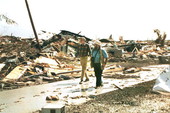 Photographer Mark Foley walking with Governor Chiles following Hurricane Andrew