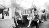 Al Sutton and Leo Eisamanon sitting on Model A Ford.