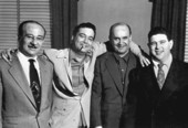 Jackie Gleason with television script writers.