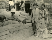 Men inspecting restoration work at the City Gates in St. Augustine, Florida.