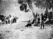 Men relaxing while on hunting and fishing expedition