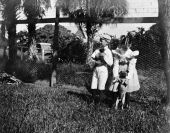 Children with pug dog and puppy - Courtenay, Florida.