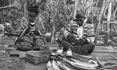 Seminole doll makers at an Indian village in the Everglades - near Miami, Florida