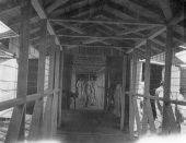 Prisoners in passageway between bunk house and mess hall