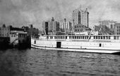 Jacksonville riverfront with steamer in foreground.