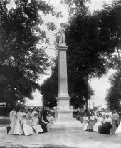 Members of the United Daughters of the Confederacy, seated around a Confederate monument in Munn Park - Lakeland, Florida