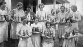 Home demonstration club members holding 3-jar exhibits of canned foods - Lamont, Florida