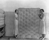 Women displaying a mattress made by FERA workers - Jacksonville, Florida