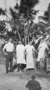 Lewis Reed and 3 cooks near a pitcher pump - Miami, Florida