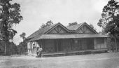 Two men outside the post office and F.W. Mill General Store - Narcoossee, Florida