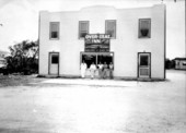 Five men standing outside the Over Seas Inn - Islamorada, Florida